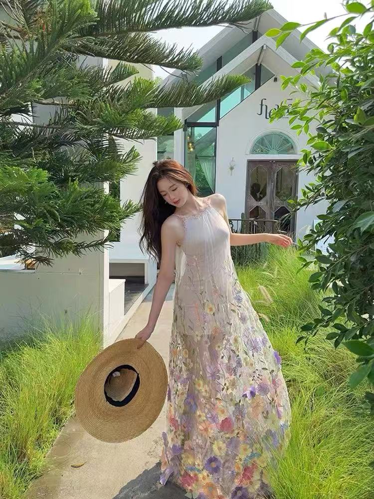 A three-dimensional floral French halter dress with a Monet Garden vacation style and a beach vacation vibe