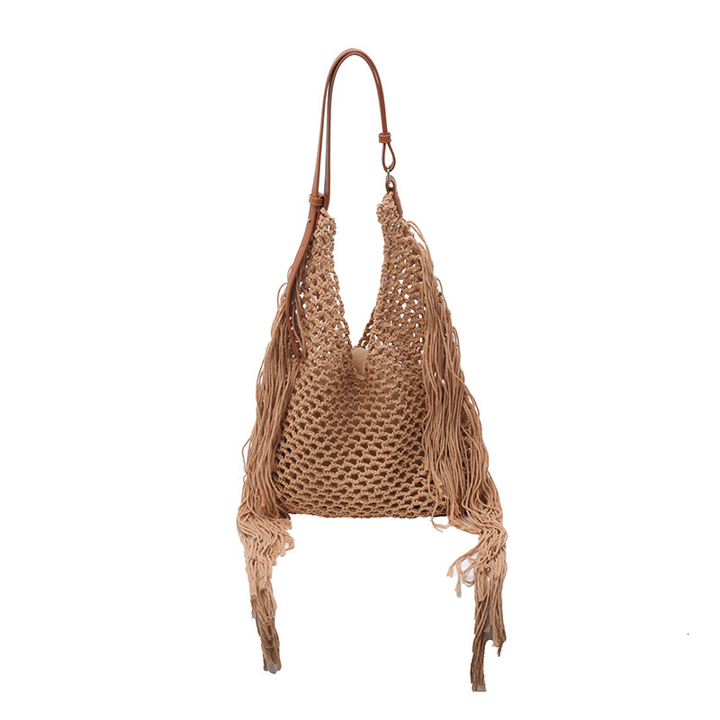 designer Hollow Handwoven Beach Bag for Women 2025 New Commuter Versatile Retro Tassel Vacation Style Single Shoulder Bucket Bag