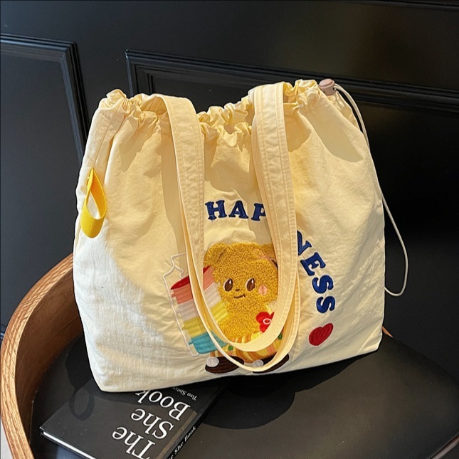 designer 2025 New Literary College Style Simple Large Capacity Tote Bag for Women Trendy Versatile Class Commuting Shoulder Bag