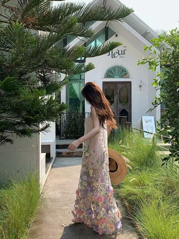 A three-dimensional floral French halter dress with a Monet Garden vacation style and a beach vacation vibe