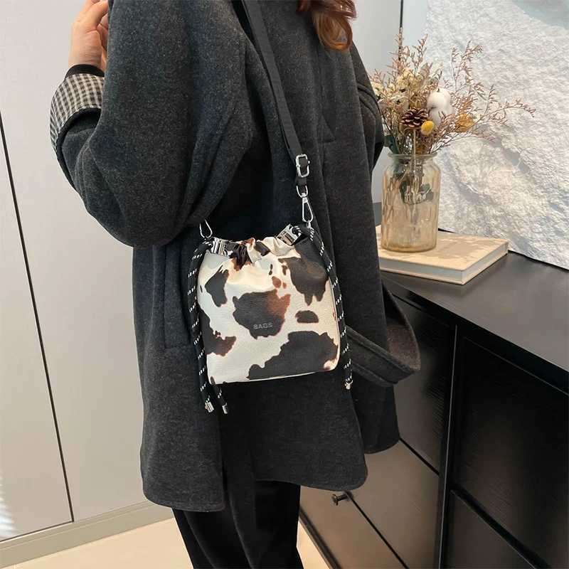 New Womens Mini Leopard Crossbody Bag Pu Leather Bucket Bag Drawstring Shoulder Bag Wide Strap Womens Bags Large Storage Bags XJ250604