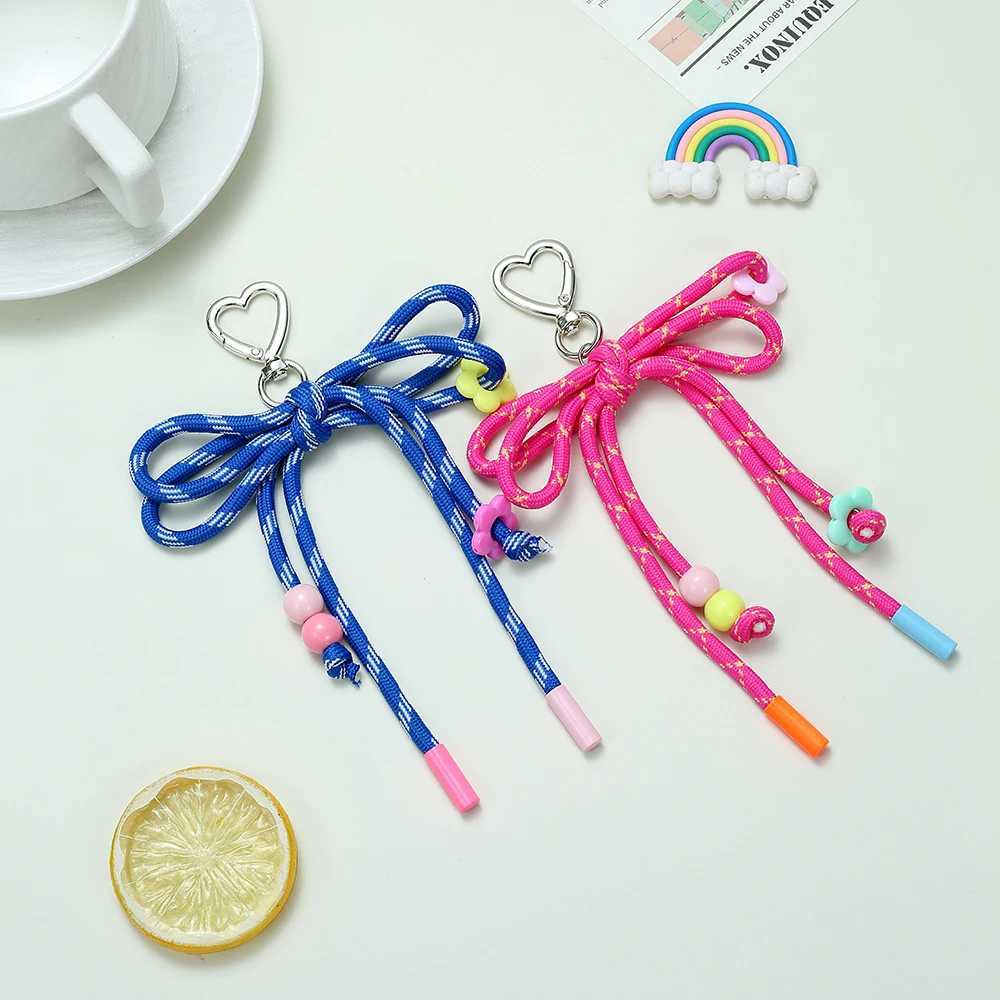 2025 Fashion New Colorful Hand Woven Bow Keychain Charming Heart Buckle Ring Small Flower Bead Bag Keychain Accessory W250604