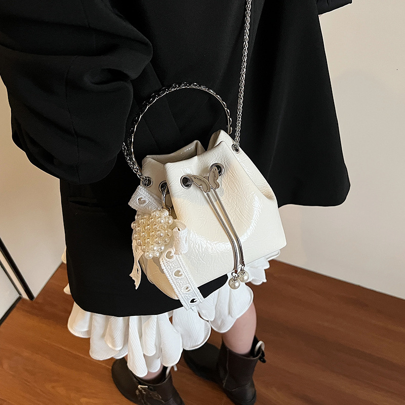 designer 2025 Summer New High-End Handheld Bucket Bag for Women with Chain Drawstring Shoulder Bag Niche Crossbody Handbag