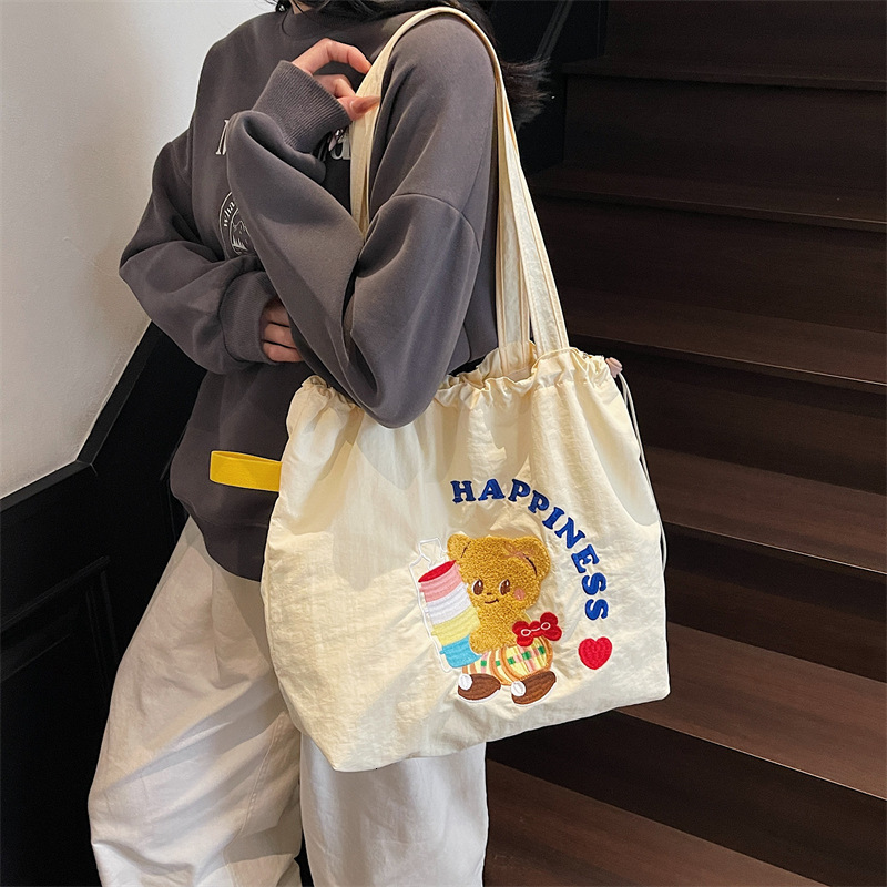 designer 2025 New Literary College Style Simple Large Capacity Tote Bag for Women Trendy Versatile Class Commuting Shoulder Bag