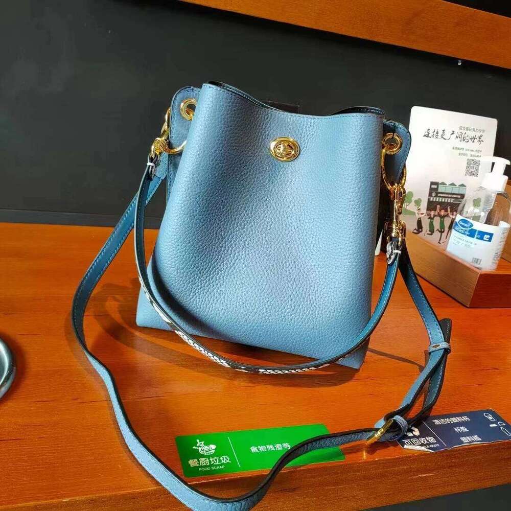 New genuine leather women s Korean version with contrasting lock buckle single shoulder crossbody bucket bag