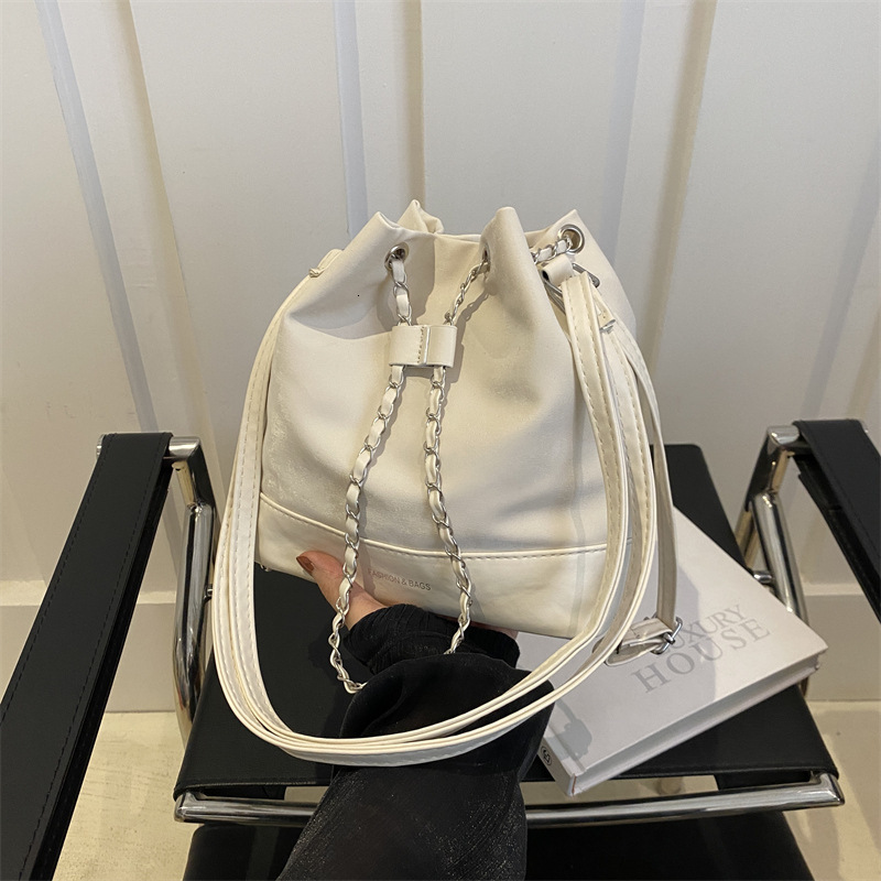 Women s bucket trend bag new trend niche design women s chain backpack designer fashionable slanted white backpack shoulder bag