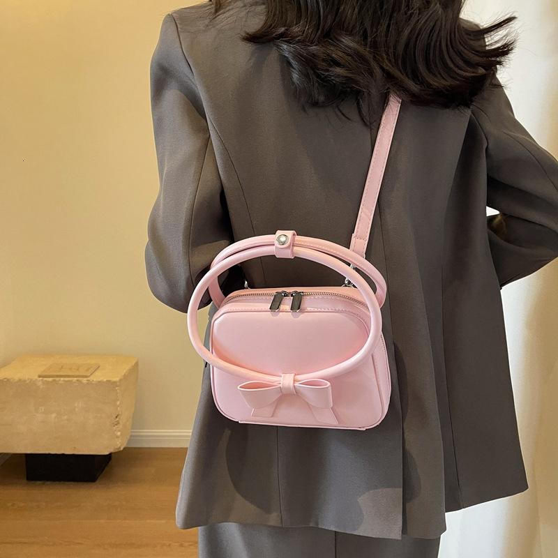 Free Shipping Designer Bag 2025 Spring/summer New Versatile Sweet And Spicy Girl Handheld Butterfly Bow Mobile Crossover Small Bag