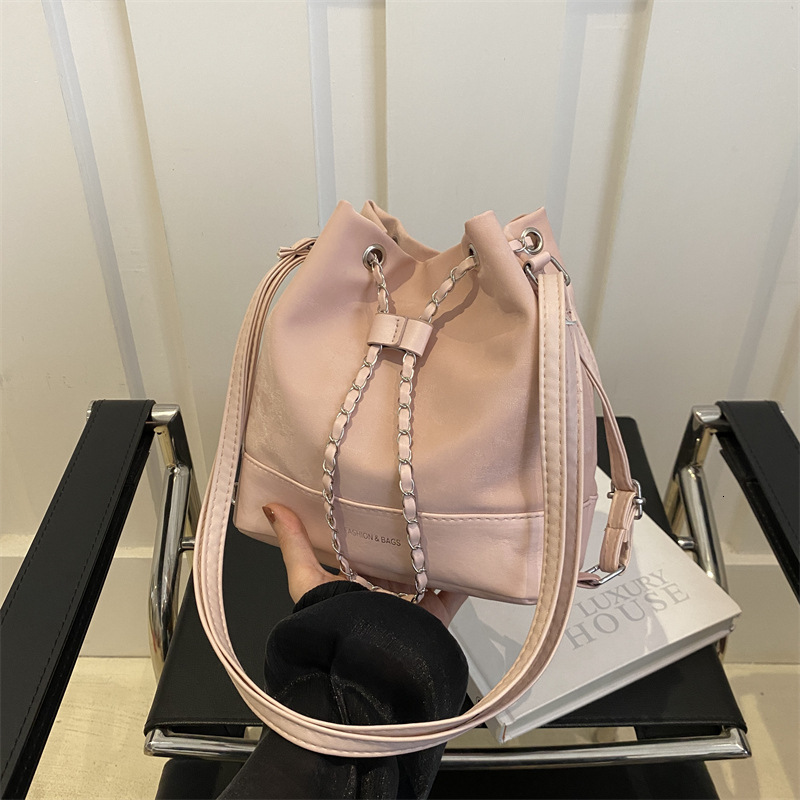Women s bucket trend bag new trend niche design women s chain backpack designer fashionable slanted white backpack shoulder bag