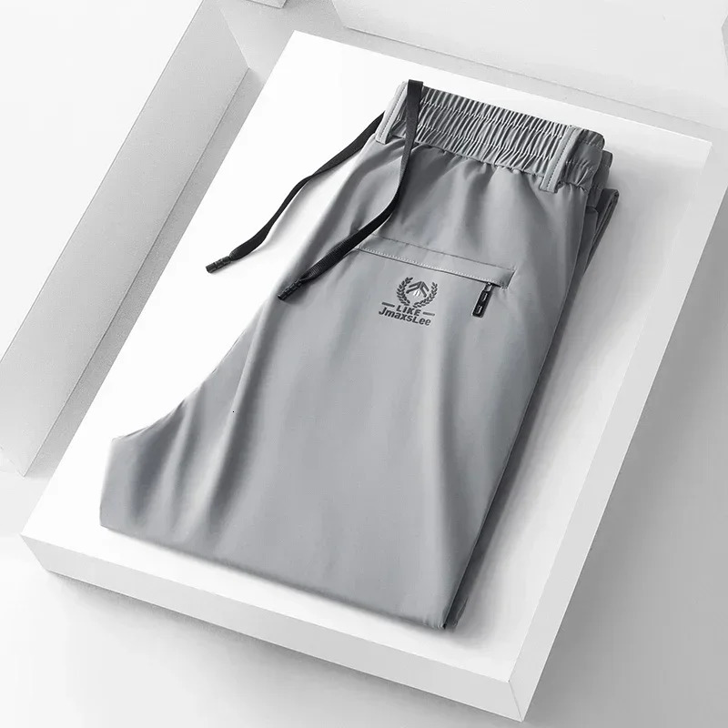 2024 Summer Soft Ice Silk Fabric Mens Thin Casual Pants Koreanstyle Fashion Straight High Stretch Trousers Male 250605Z