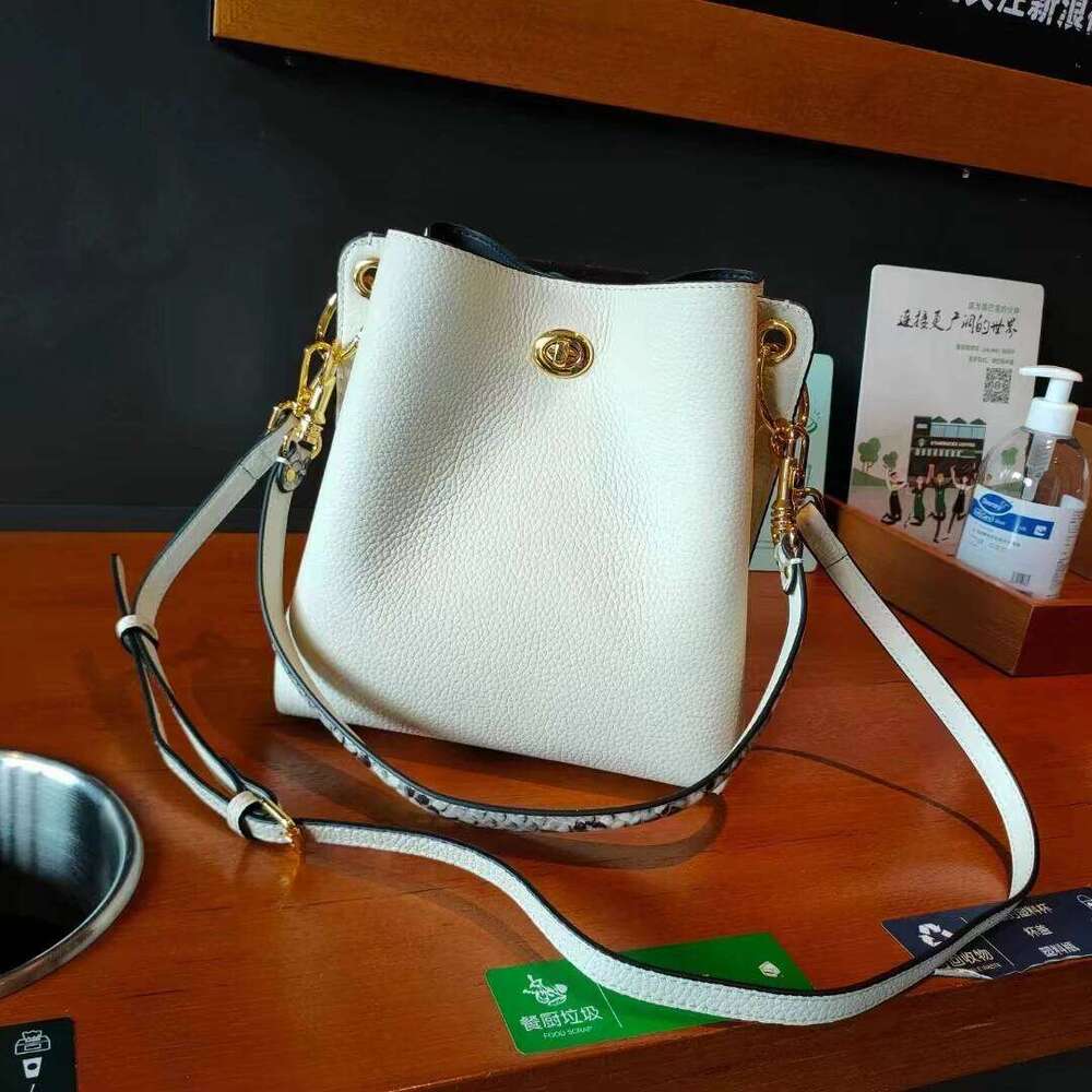 New genuine leather women s Korean version with contrasting lock buckle single shoulder crossbody bucket bag