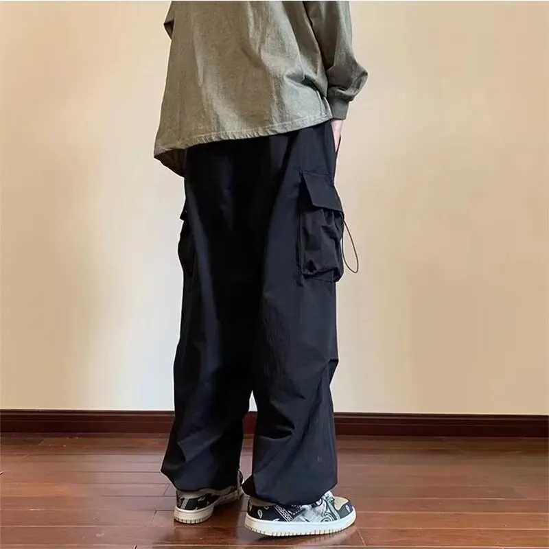 2025 New Mens Overalls Multi-Pocket American Hip-Hop Pants Mens Ins High Street Spring And Autumn Bunched Foot Assault Pants Z250605