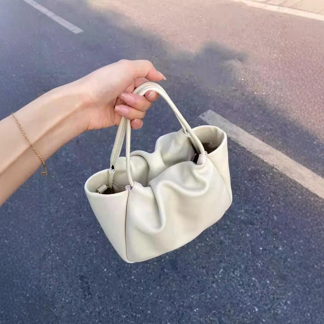 Top High Quality New Style New Soft Leather Cloud Pleated Small Handbag Women's Tote Basket Niche High-end Commuter Crossbody Bag New Free Delive