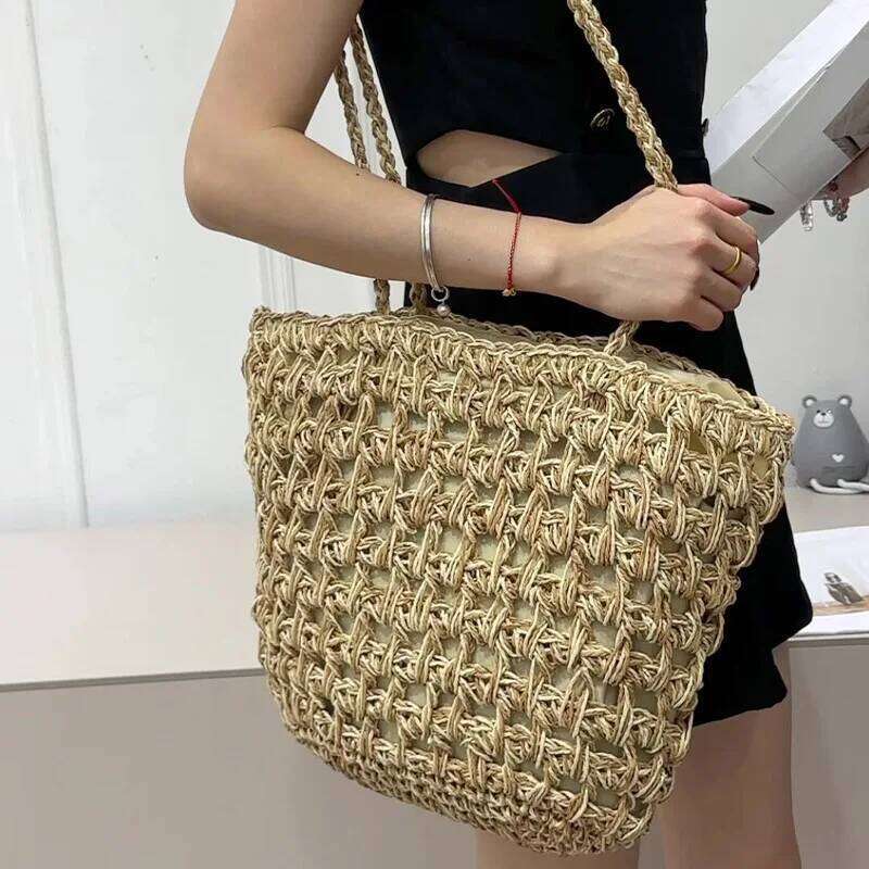 2025 Summer New Women's Big Straw Fashion Beach Handbag Hollow Design Braided Exquisite Metal Chain Bag