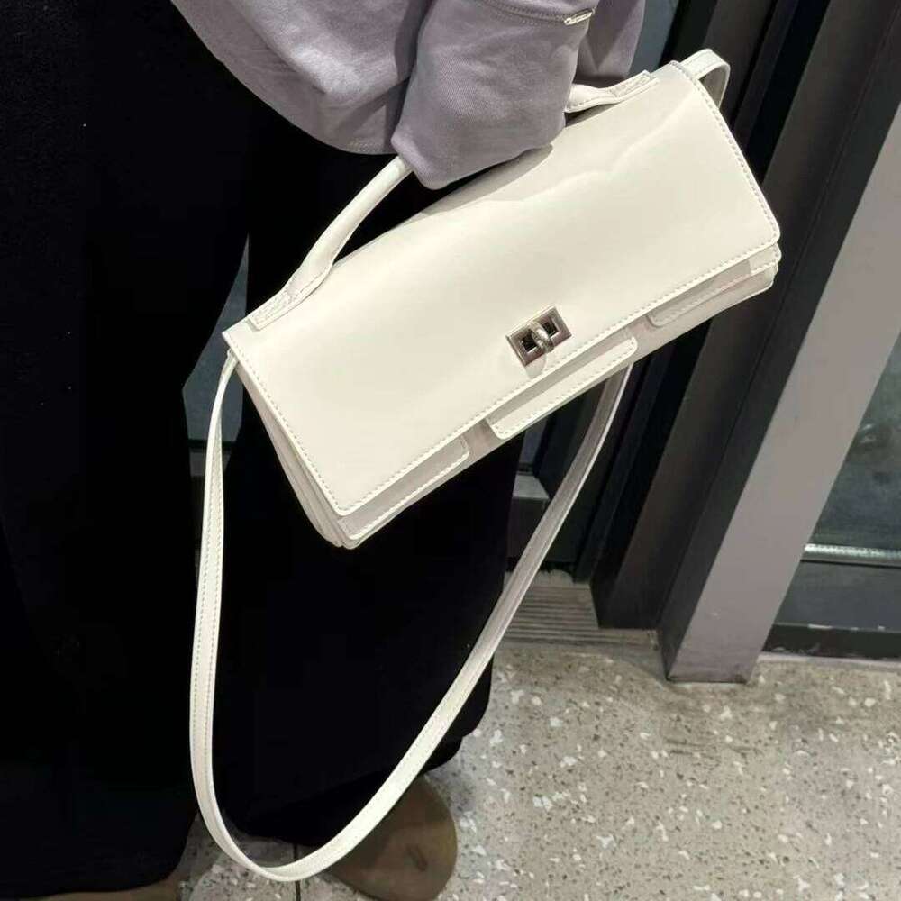 Genuine leather handbag 2025 new niche design lock small square vintage motorcycle style cowhide one-shoulder crossbody bag