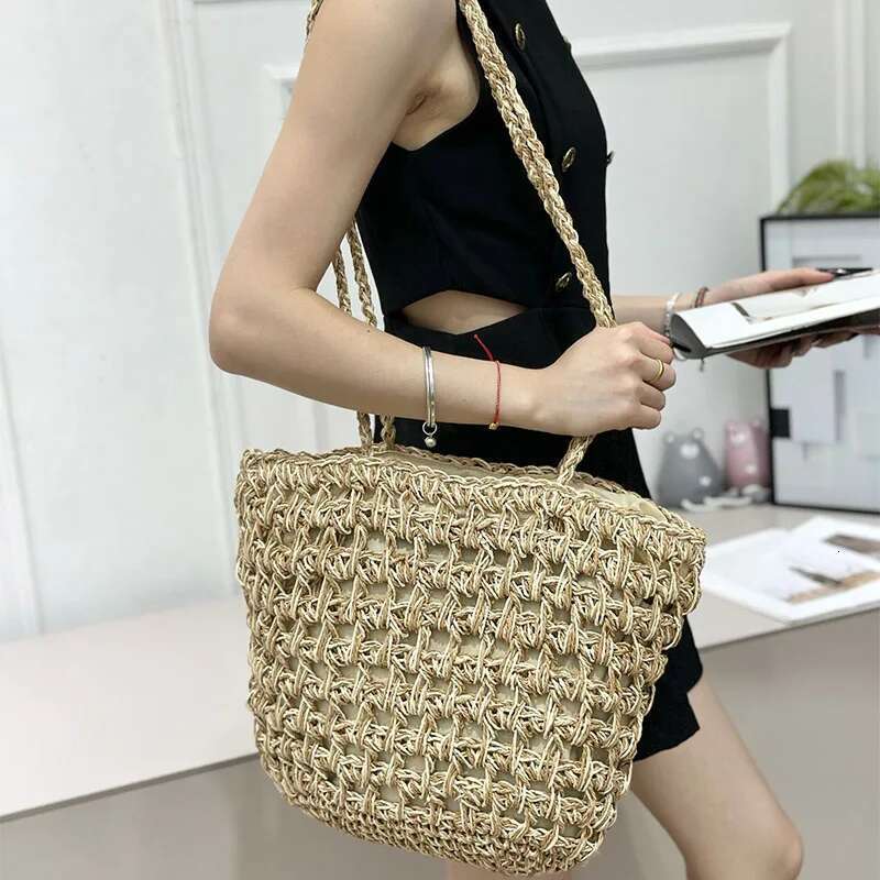 2025 Summer New Women's Big Straw Fashion Beach Handbag Hollow Design Braided Exquisite Metal Chain Bag