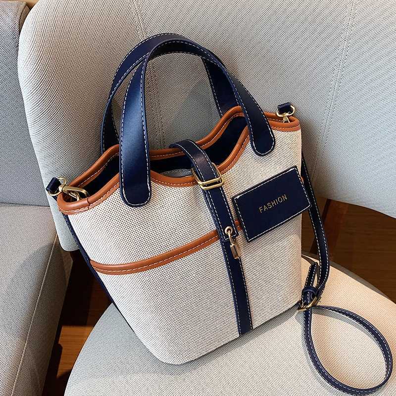 Canvas PU Spliced Bucket Bag New Womens Personalized Design Large Capacity Crossbody Bag Versatile Commuting Handbag M250606