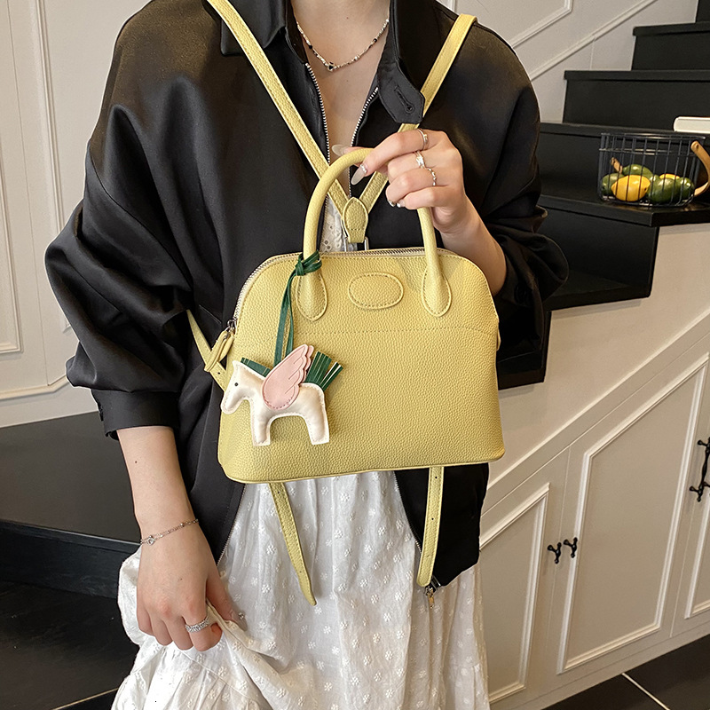 designer Niche Shell Commuter Backpack for Women 2025 New Simple Handheld Women's Bag Lightweight Ins Style Design Backpack