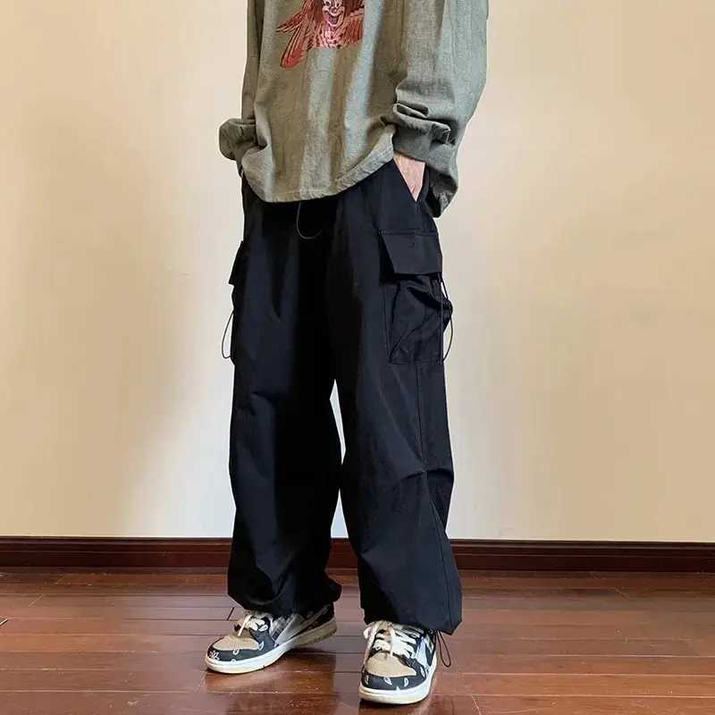 2025 New Mens Overalls Multi-Pocket American Hip-Hop Pants Mens Ins High Street Spring And Autumn Bunched Foot Assault Pants Z250605