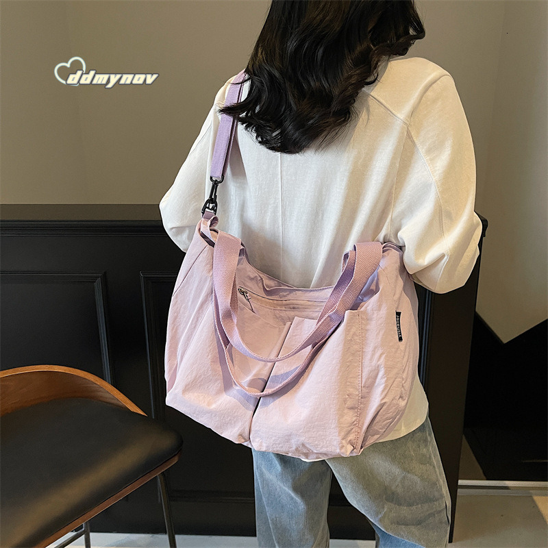 Hot Selling Canvas Women's 2025 New Simple Fashion Large Capacity Shoulder Tote Dumpling Bag ddmynov