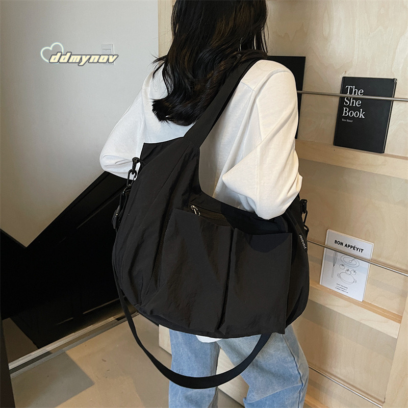 Hot Selling Canvas Women's 2025 New Simple Fashion Large Capacity Shoulder Tote Dumpling Bag ddmynov