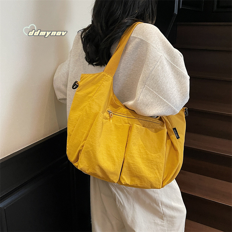 Hot Selling Canvas Women's 2025 New Simple Fashion Large Capacity Shoulder Tote Dumpling Bag ddmynov