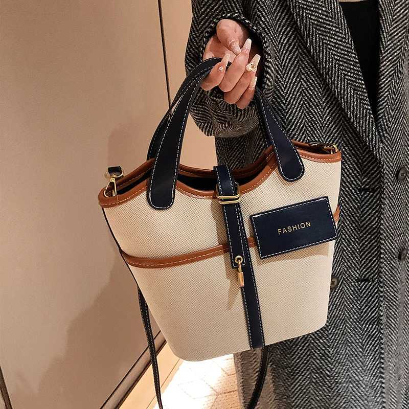 Canvas PU Spliced Bucket Bag New Womens Personalized Design Large Capacity Crossbody Bag Versatile Commuting Handbag M250606