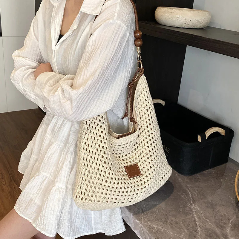 Summer fashion hollow woven bag ins simple temperament shoulder large capacity vacation womens bag 250605