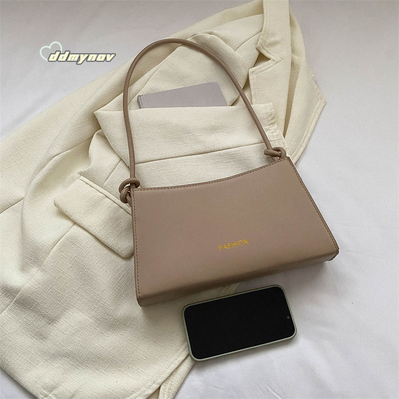 Unique French Style Candy Color Underarm for Women 2024 New Fashion Simple Shoulder Stylish Handbag Baguette Bag