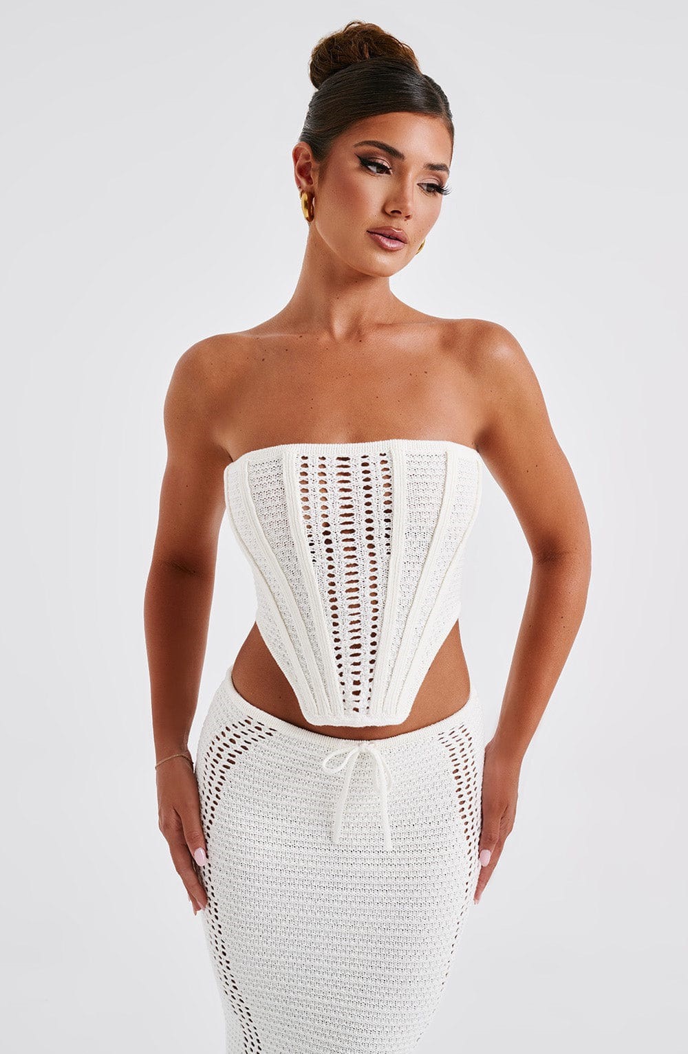 sexy and trendy backless, strapless top coat, hip-hugging long dress, and knitted set