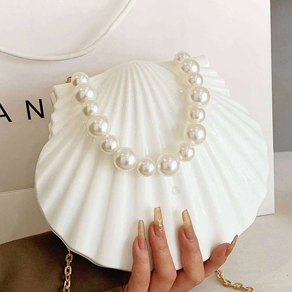 Acrylic scallop-shaped dinner bag is suitable for parties, vacations, banquets, daily and various ocns