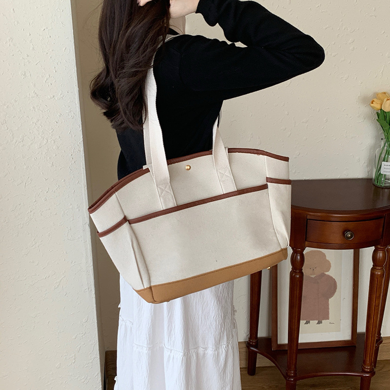 designer Korean INS Mommy Bag Large Capacity Casual Versatile Single Shoulder Mother and Baby Bag Underarm Handheld Lightweight Canvas Mommy Bag