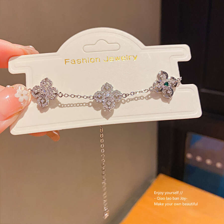 Luxury jewelry designer bracelet clover chain Zircon Four-Petal Flower Pull-Open 2025 New Super Shiny Exquisite Bracelet Niche High-End Design Jewelry