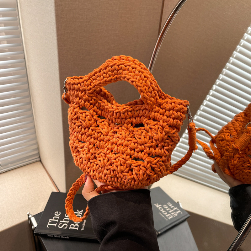 designer 2025 New Hollow Woven Bag for Women Versatile Crossbody Bag Vacation Beach Bag Niche Artistic Shoulder Crossbody Bag