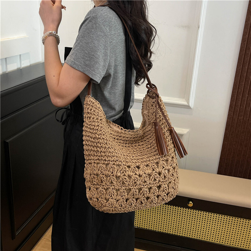 designer Casual Tassel Straw Bag 2025 New Niche Hollow Woven Bag Beach Vacation Style Shoulder Bag for Women