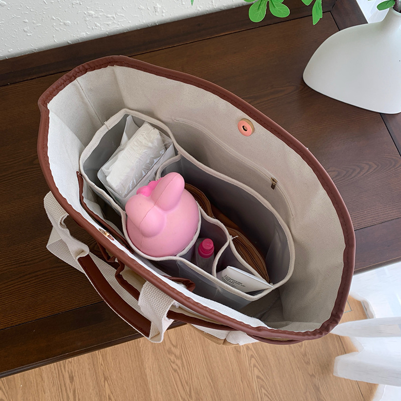 designer Korean INS Mommy Bag Large Capacity Casual Versatile Single Shoulder Mother and Baby Bag Underarm Handheld Lightweight Canvas Mommy Bag