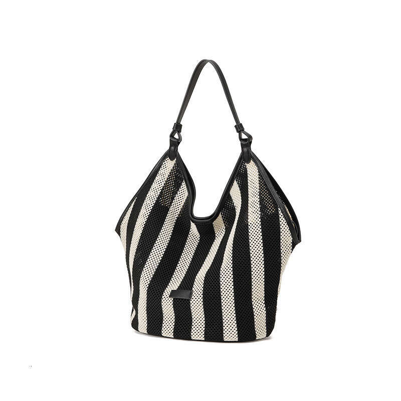 Guangzhou Vacation Hollow Woven Tote for Women Summer Casual Large Capacity Straw Bucket Bag GUHUISHU