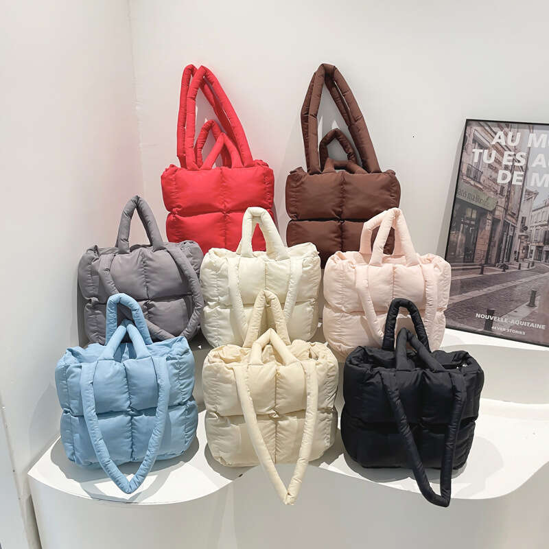 Fashion Handheld Down Simple Niche Versatile Women's Bag Design Sense 2025 Spring Summer New Bread Handbag