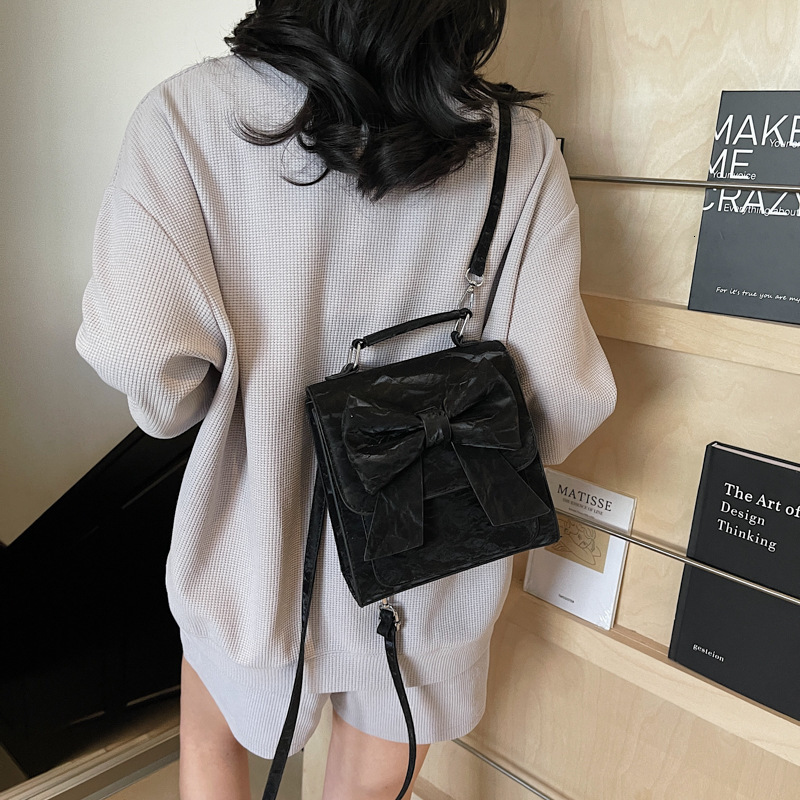 designer Women's Backpack 2025 New Style Textured Niche Design Handheld Korean Version Bowknot School Bag Casual Travel Backpack