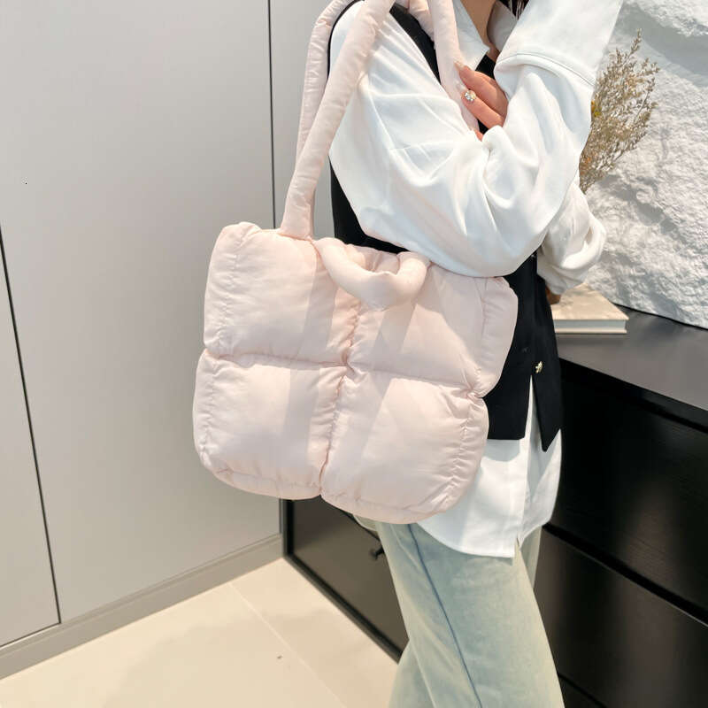 Fashion Handheld Down Simple Niche Versatile Women's Bag Design Sense 2025 Spring Summer New Bread Handbag