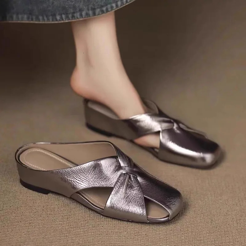 Summer Baotou Hollow Flat Shoes Womens Outer Slippers Fashion Soft Leather No Heel Soft Sole Lazy Half Slippers 250603