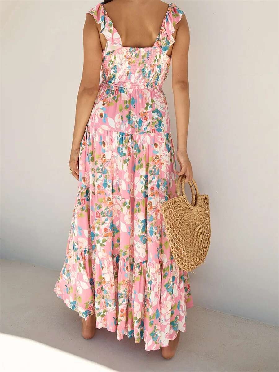 Elegant Sleeveless Maxi Dress with Boho Floral Print and Ruffled Hemline Perfect for Summer Beach Parties and Events