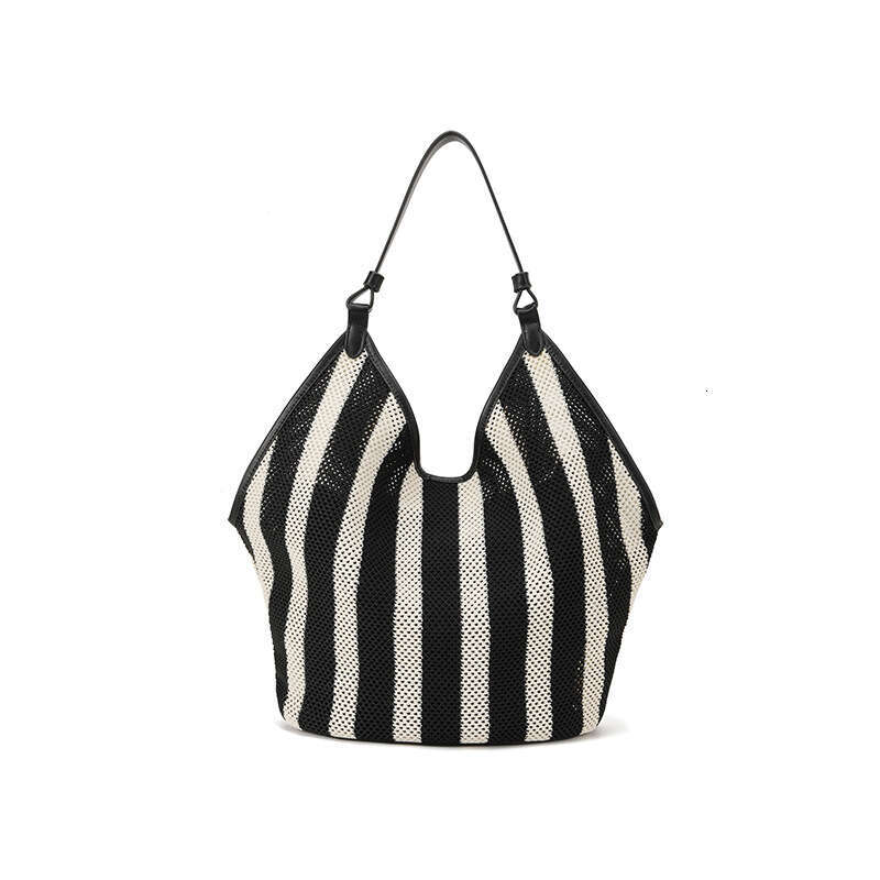 Guangzhou Vacation Hollow Woven Tote for Women Summer Casual Large Capacity Straw Bucket Bag GUHUISHU