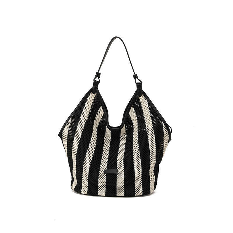 Guangzhou Vacation Hollow Woven Tote for Women Summer Casual Large Capacity Straw Bucket Bag GUHUISHU