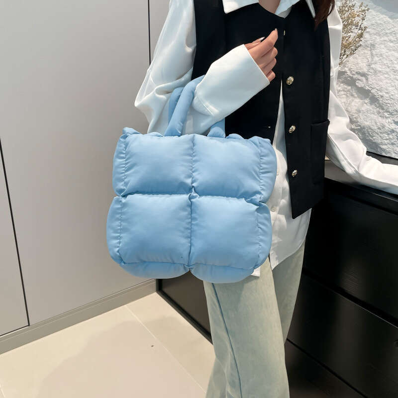 Fashion Handheld Down Simple Niche Versatile Women's Bag Design Sense 2025 Spring Summer New Bread Handbag