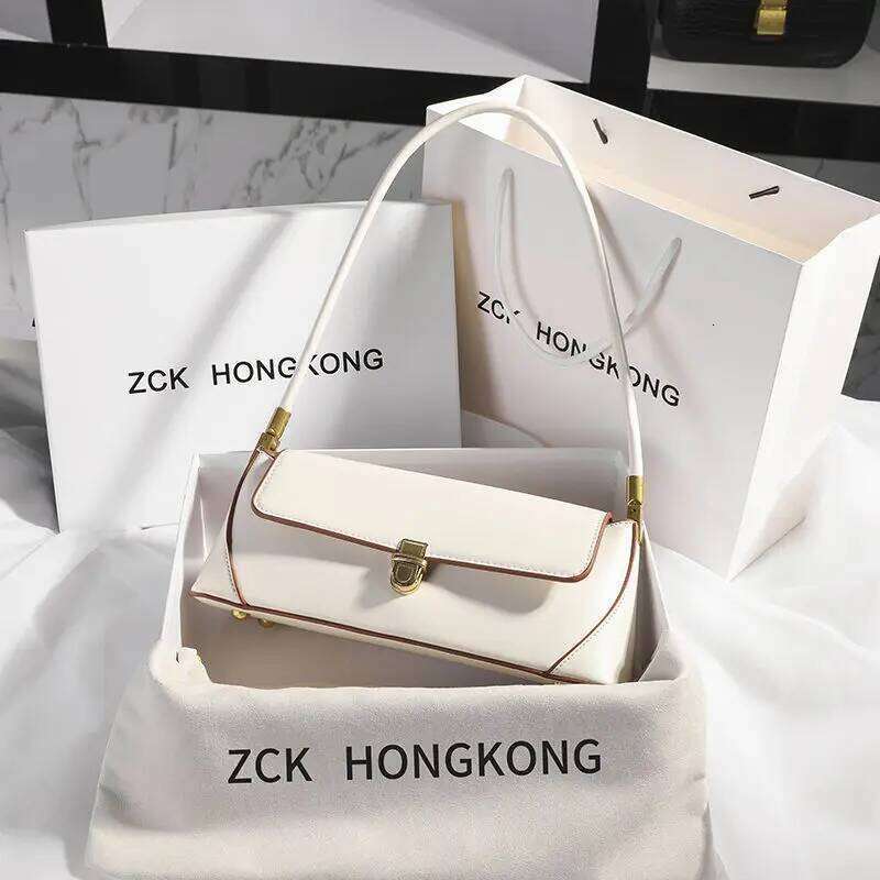 Armpit retro niche design high end solid color one shoulder portable genuine leather women s bag spring and summer versatile