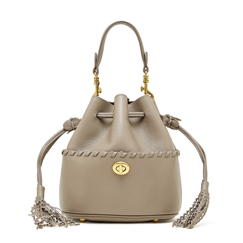 Free Shipping Luxury Top Layer Cowhide Bucket Bag 2025 New Designer Leather Women's Bag Tassel Niche Drawstring Shoulder Crossbody Bag Handbag
