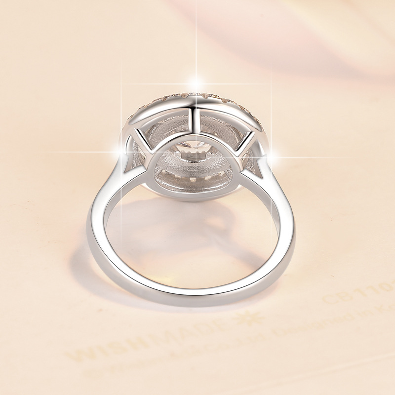 Artisan Crafted Wedding Band Highlighting A Lustrous Single Cut Moissanite Gemstone Amidst Floral Design