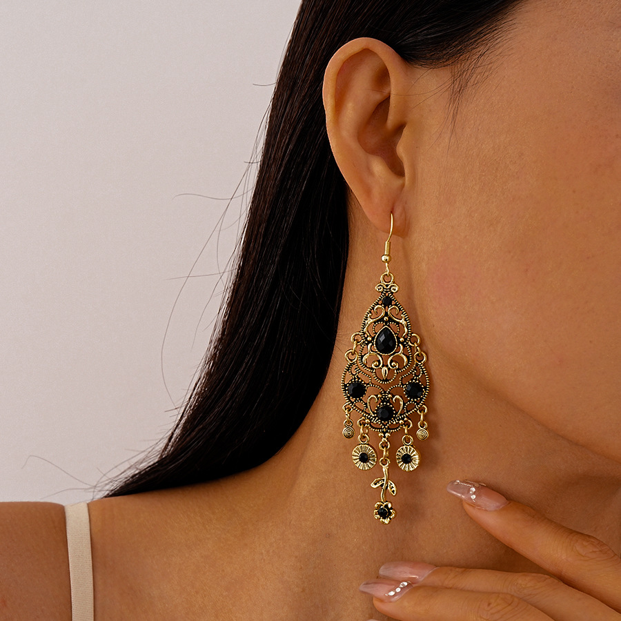 Vintage Filigree Drop Earrings with Black Gemstone Accents Elegant Court Inspired Statement Jewelry for Women