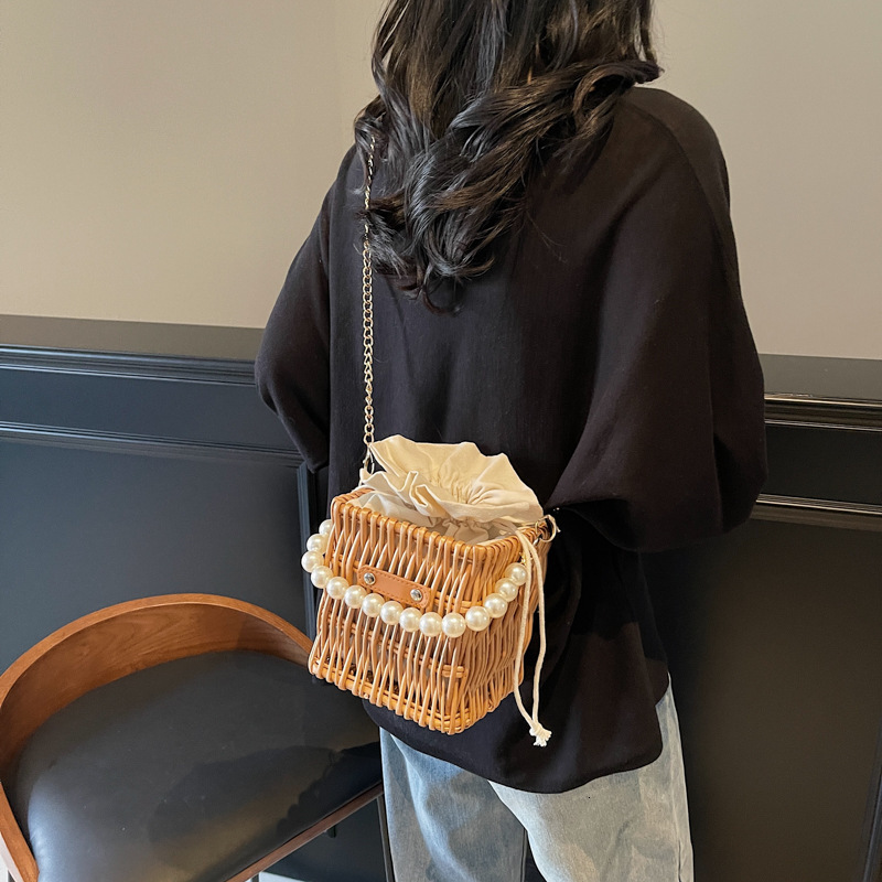 designer bag High-end Pearl Chain Handbag for Women 2025 New Woven Straw Shoulder Crossbody Bucket Bag