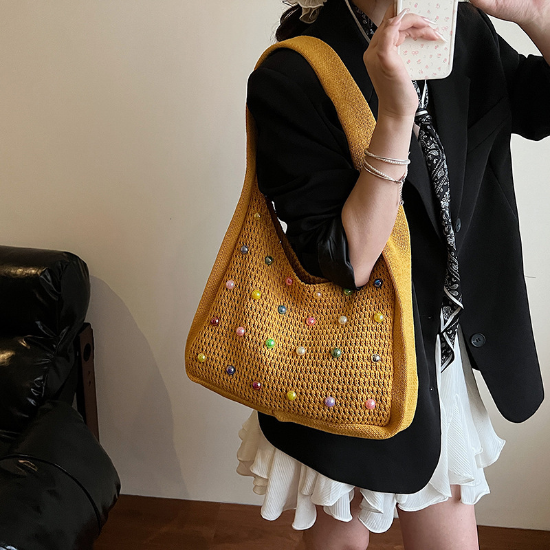 designer 2025 Trendy New Lazy Style Woven Women's Bag Large Capacity Versatile Knitted Bag Pearl Hollow Underarm Shoulder Bag for Women